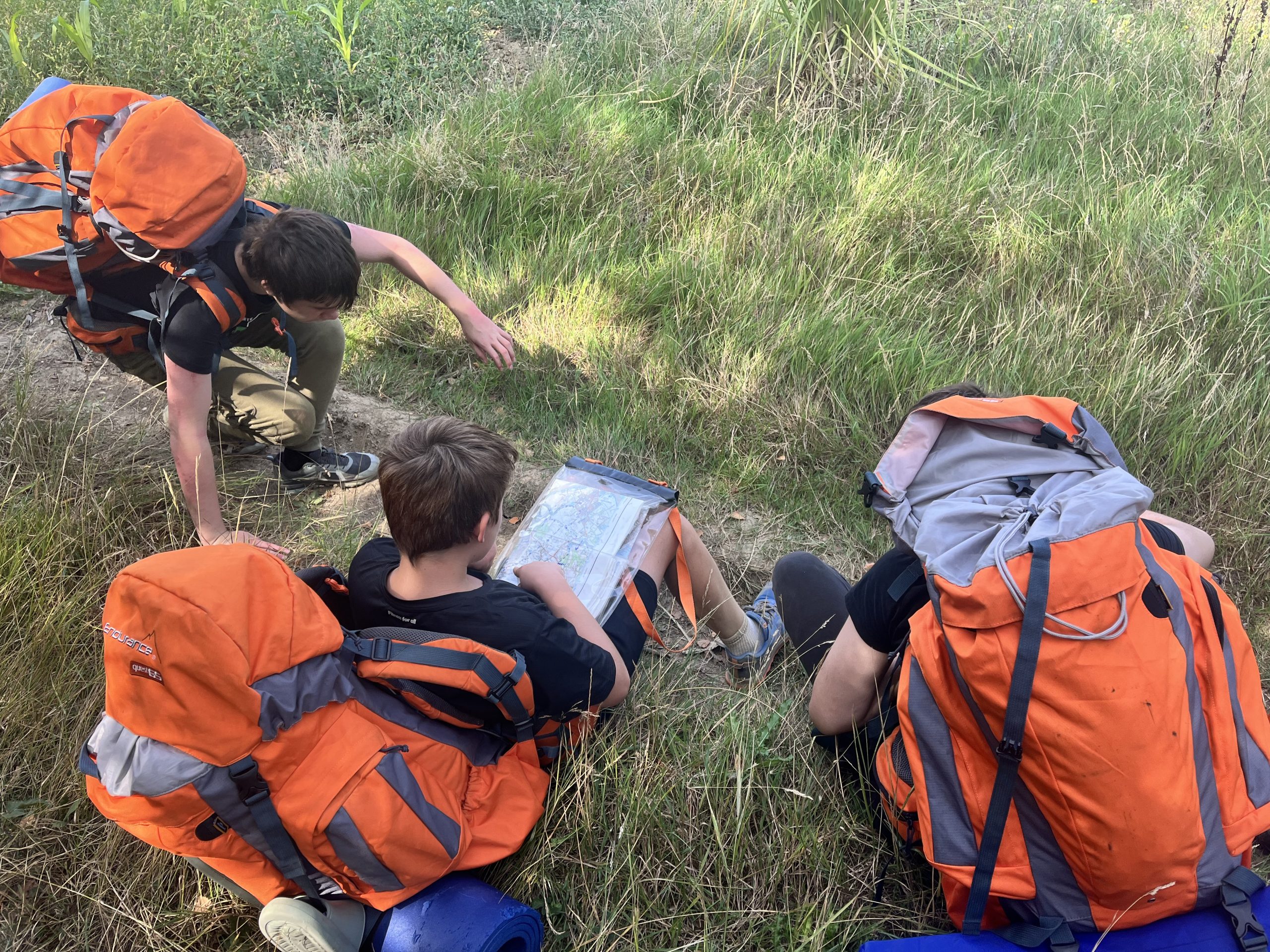 Duke of Edinburgh's Award Bronze group sitting down and looking at the map